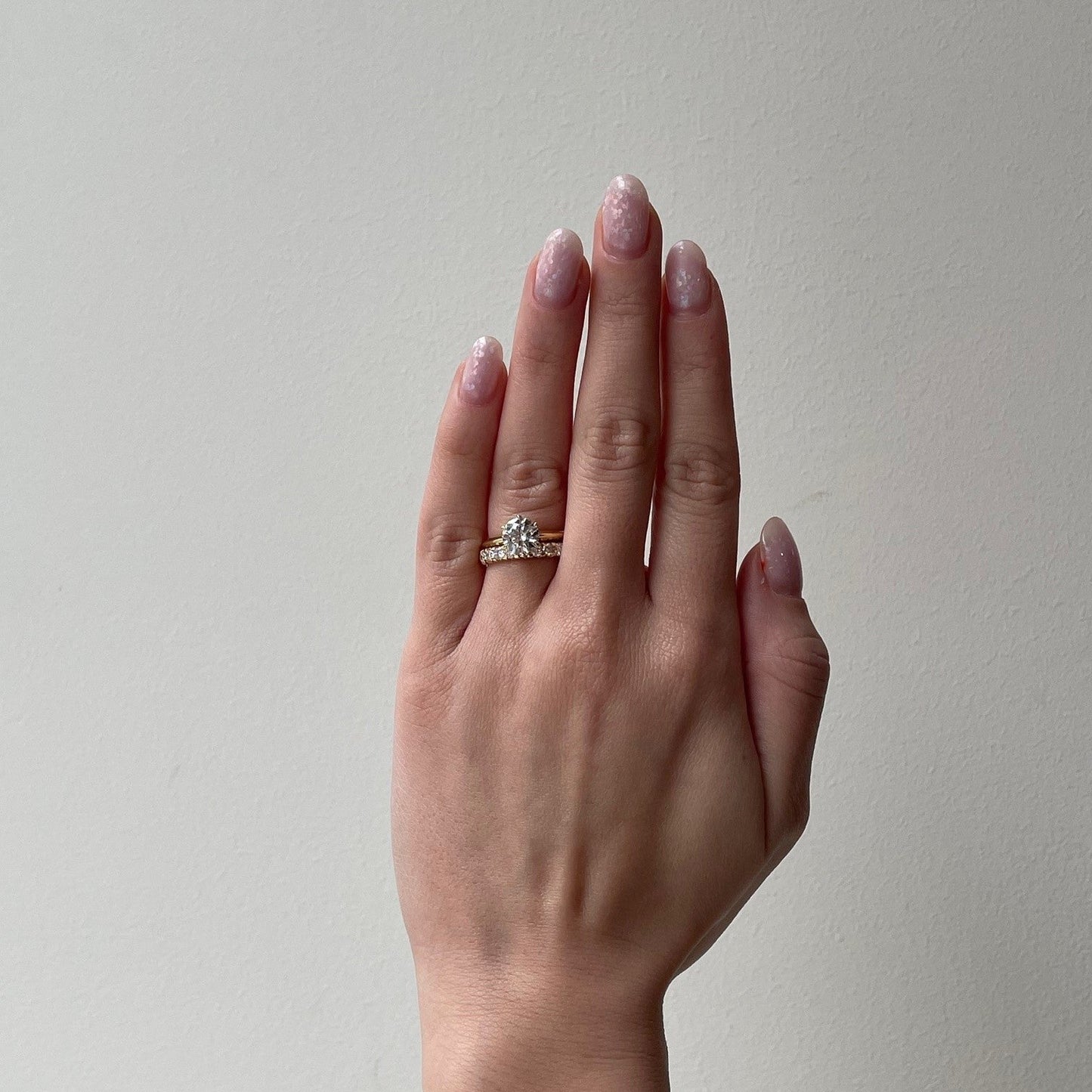 Lyra solitaire engagement ring with diamond wedding band