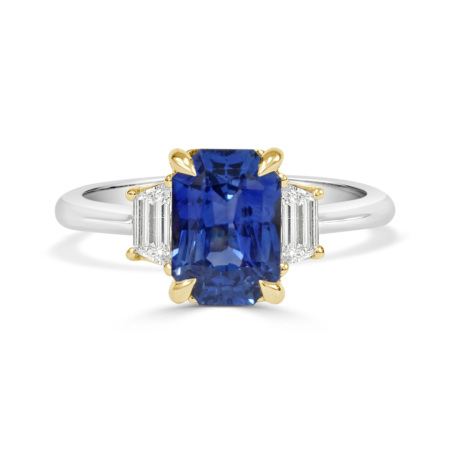 White gold Ring with a ceylon gemstone and gold accents on a white background