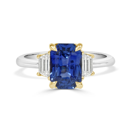 White gold Ring with a ceylon gemstone and gold accents on a white background