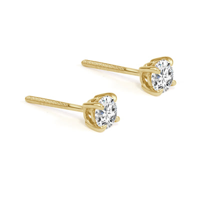 Gold stud earrings with diamonds on a white background