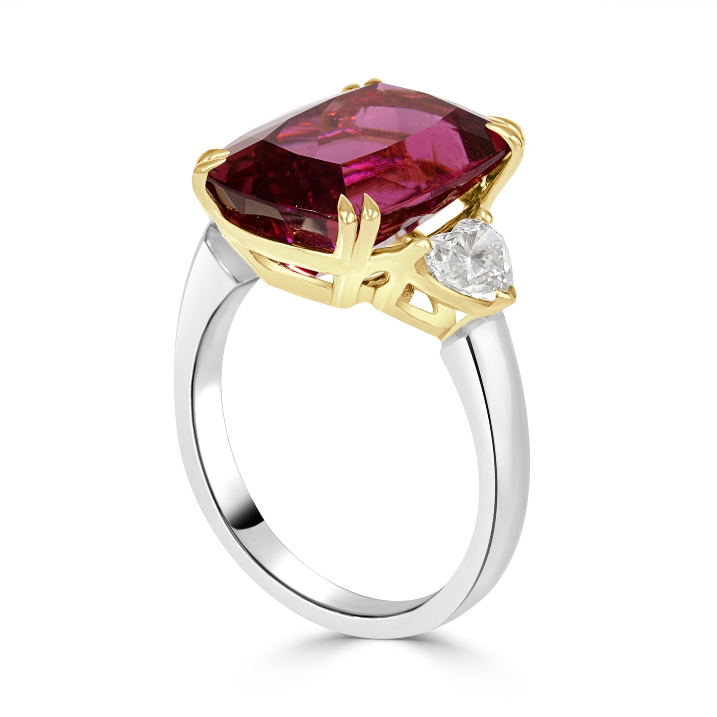 cushion cut rubelite and heart shaped diamond  trilogy on a white background