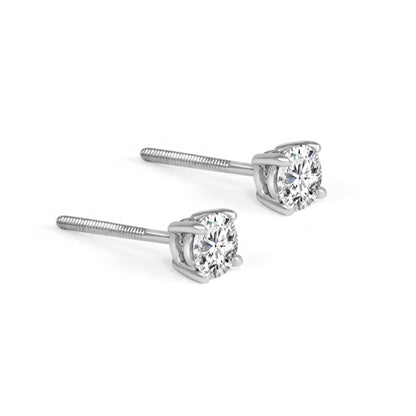 Pair of diamond stud earrings on a white background
